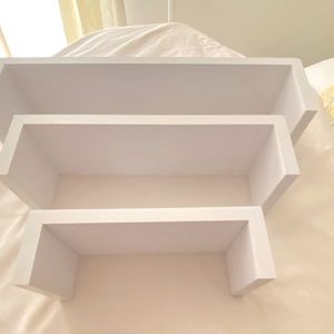 3 white shelves